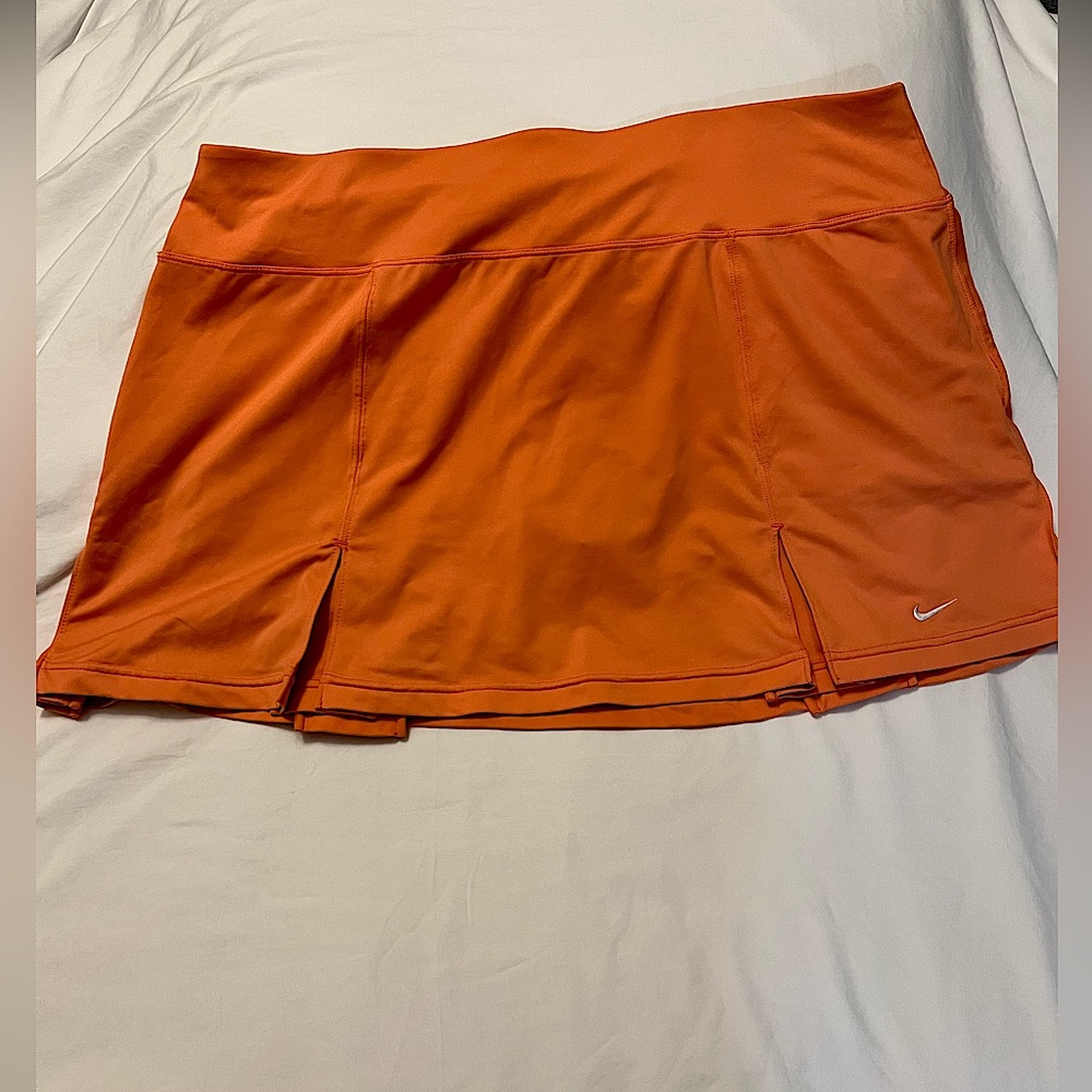 Nike dri fit skort. Peachy-orange in color. Size XL.